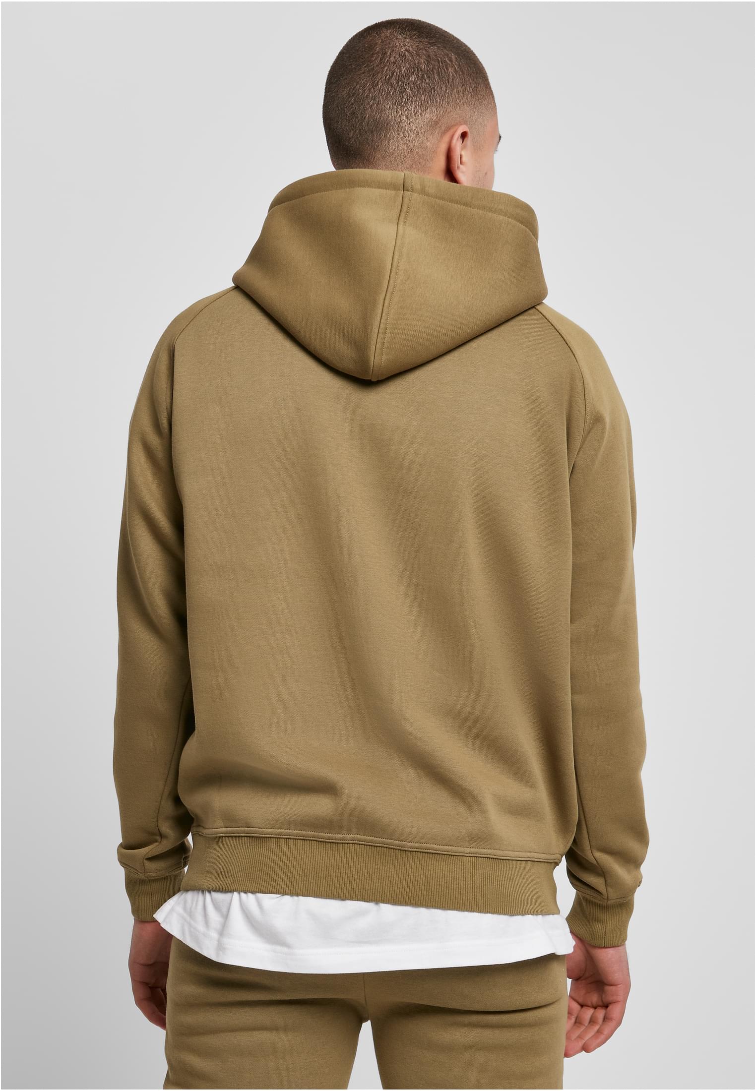 Baksidan av en man som bär en ljusgrön UC Blank Hoody.