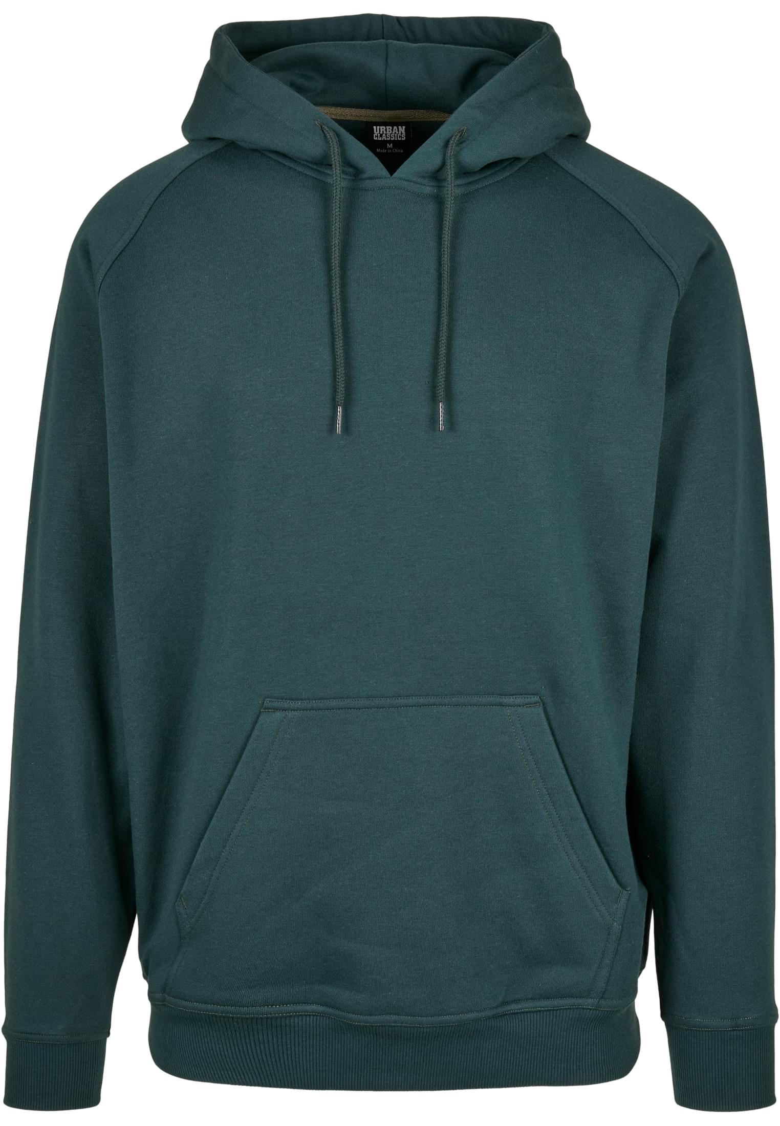 Närbild framifrån på den mörkgröna huvtröjan UC Blank Hoody, som visar huvan och kängurufickan.
