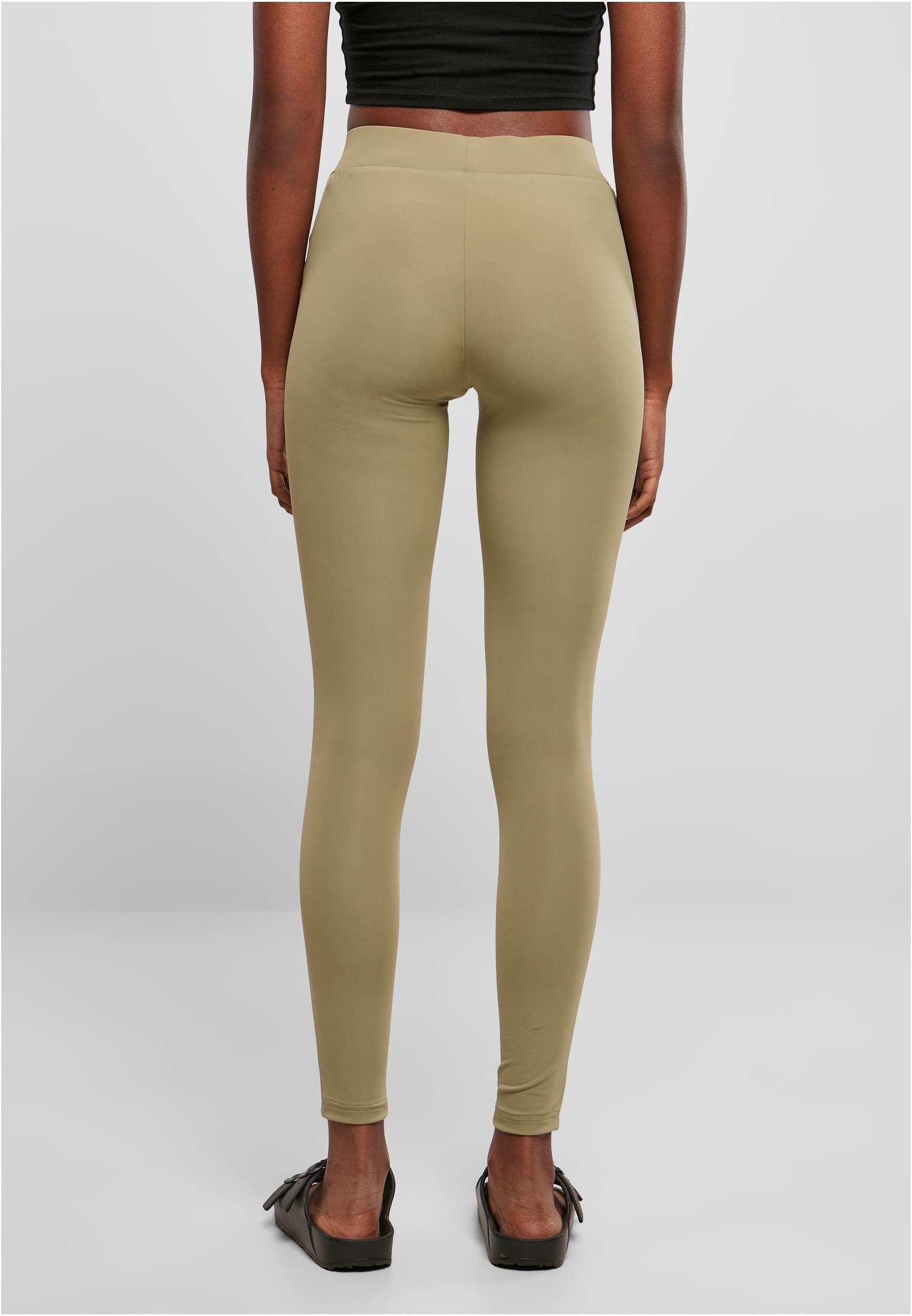 Baksidan av en kvinna som bär varmgrå Ladies Tech Mesh Leggings.