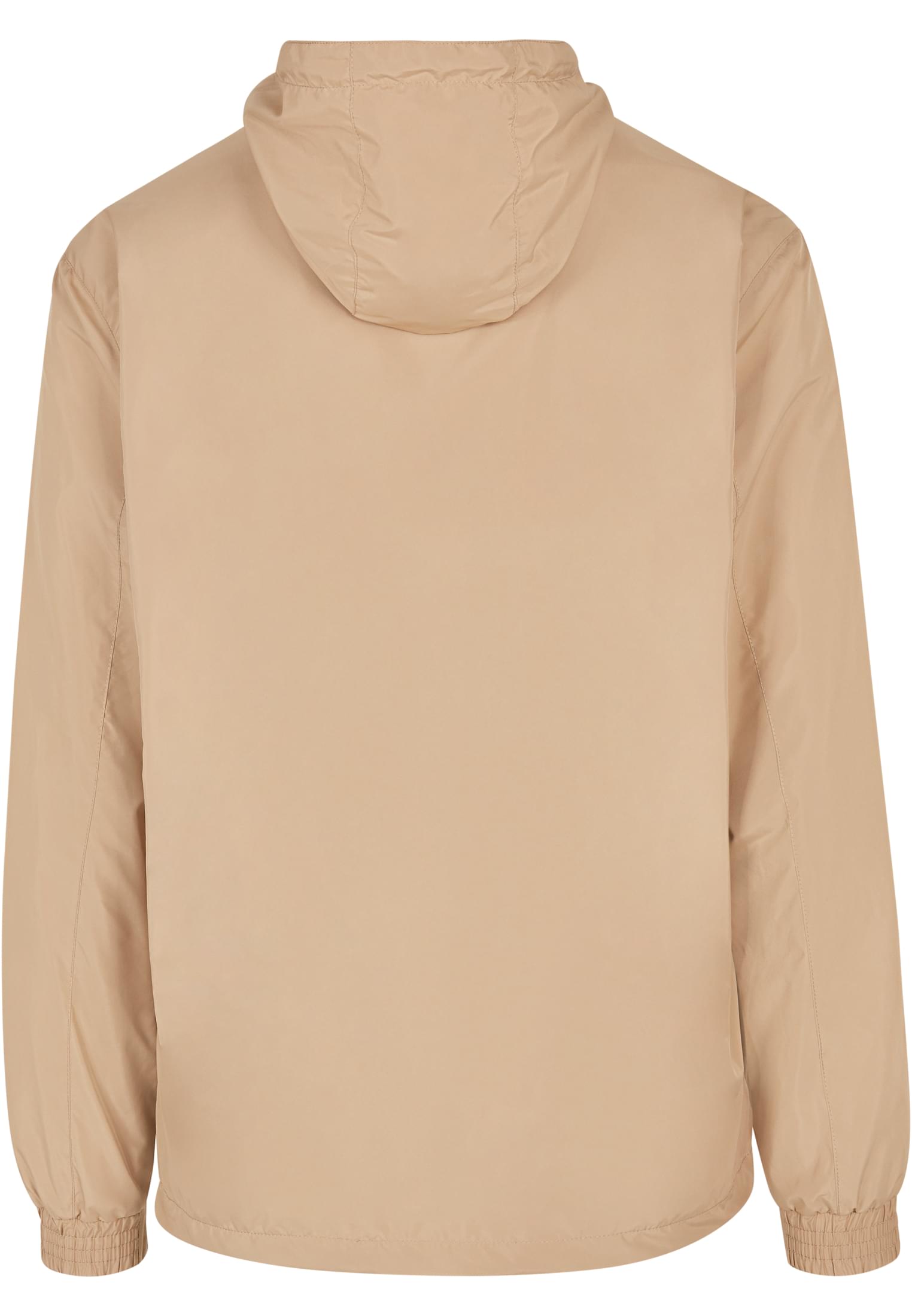 Baksidan av en beige pullover-jacka med luva.