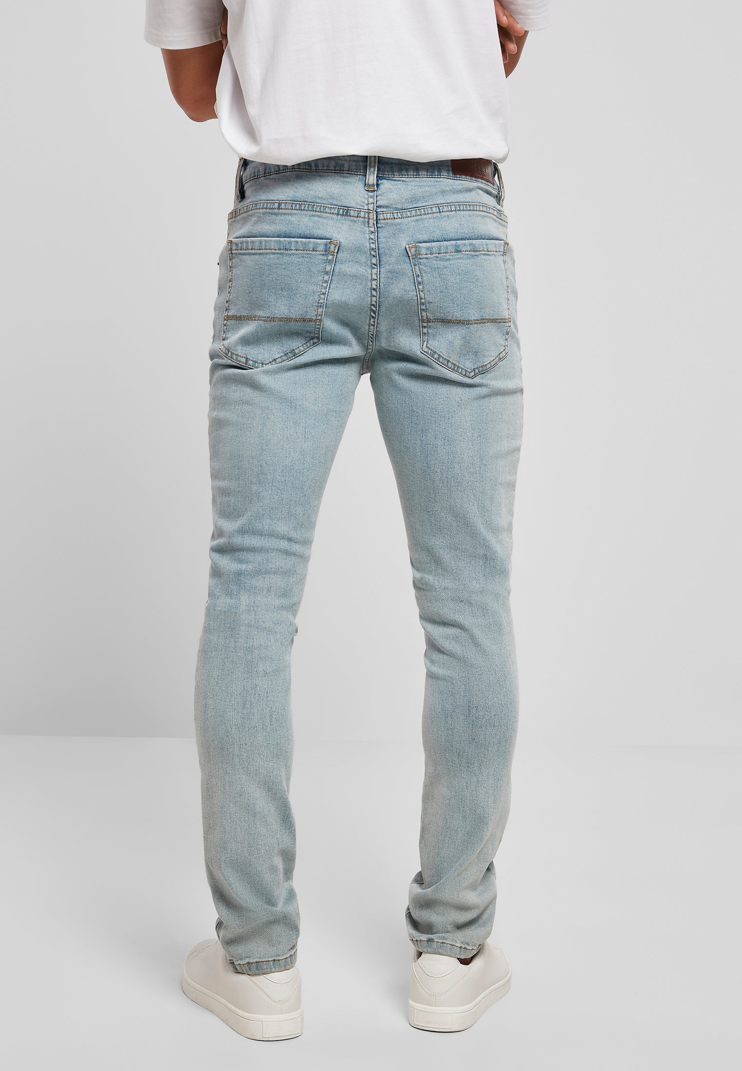 Jeans aderenti con cerniera UC