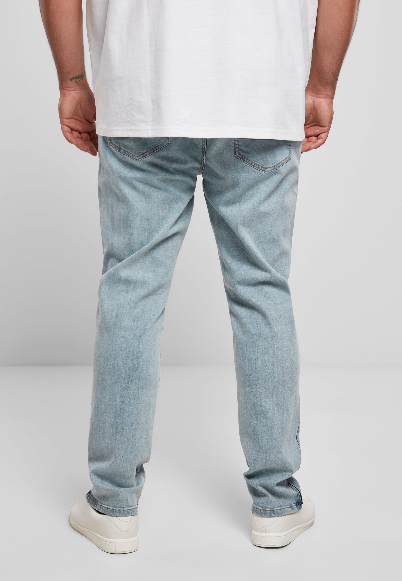 Jeans aderenti con cerniera UC