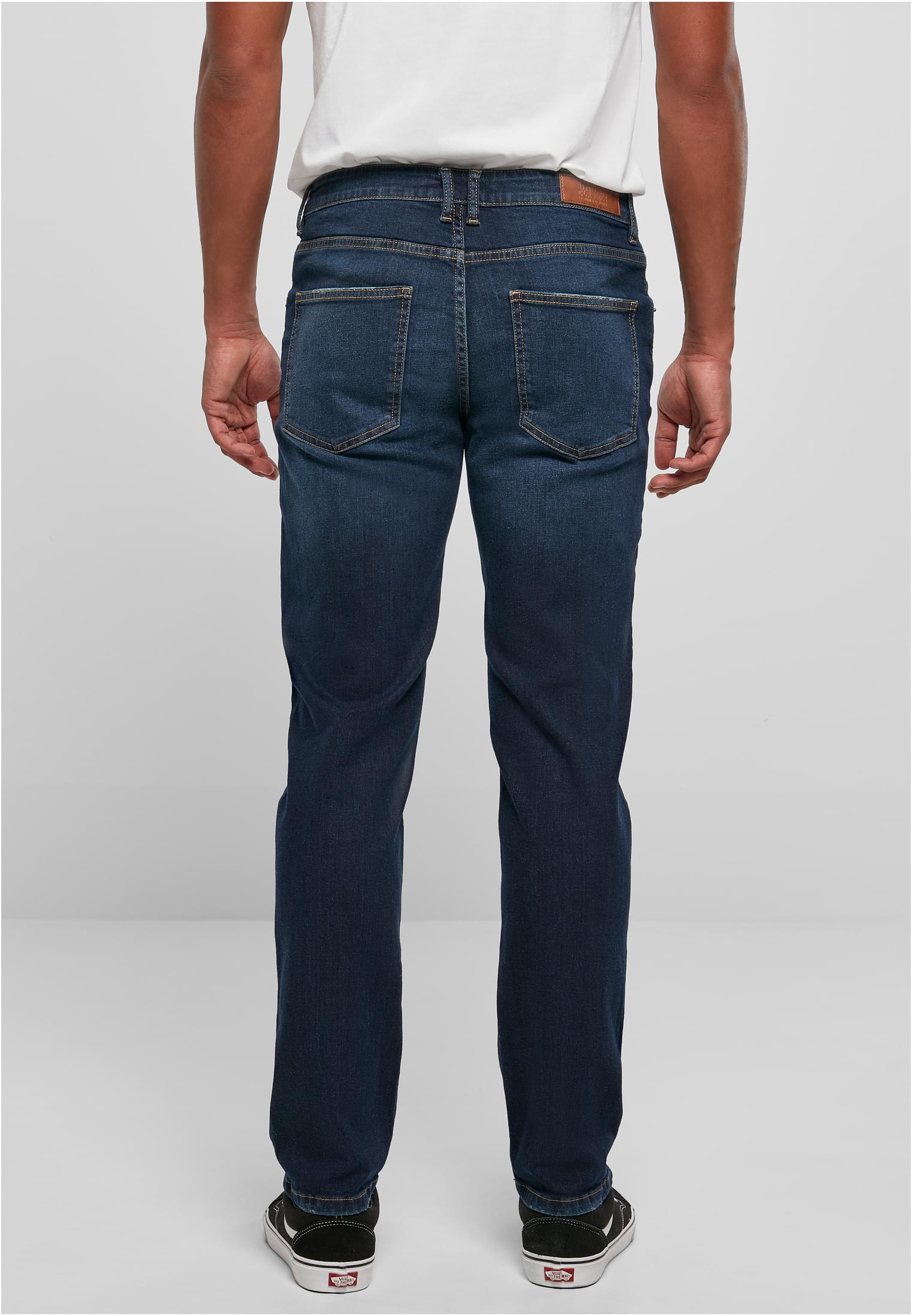 Pantaloni in denim elasticizzato effetto usurato UC