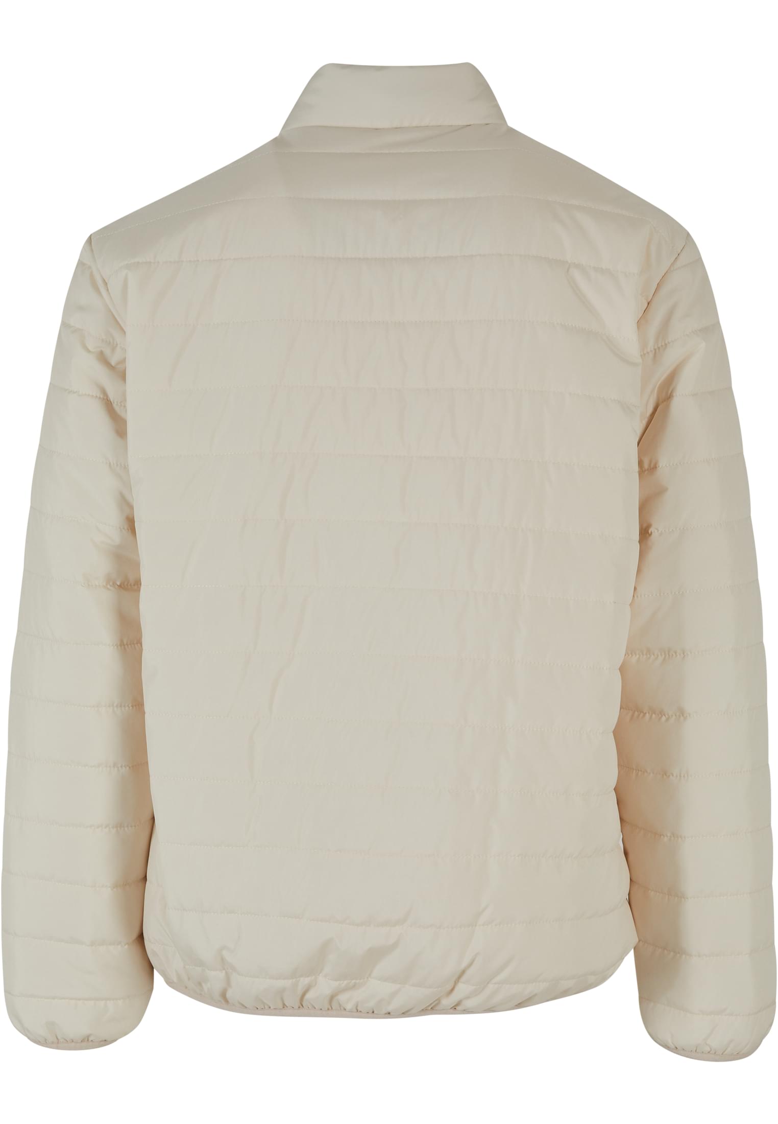 Baksidan av en beige UC Light Bubble Jacket.