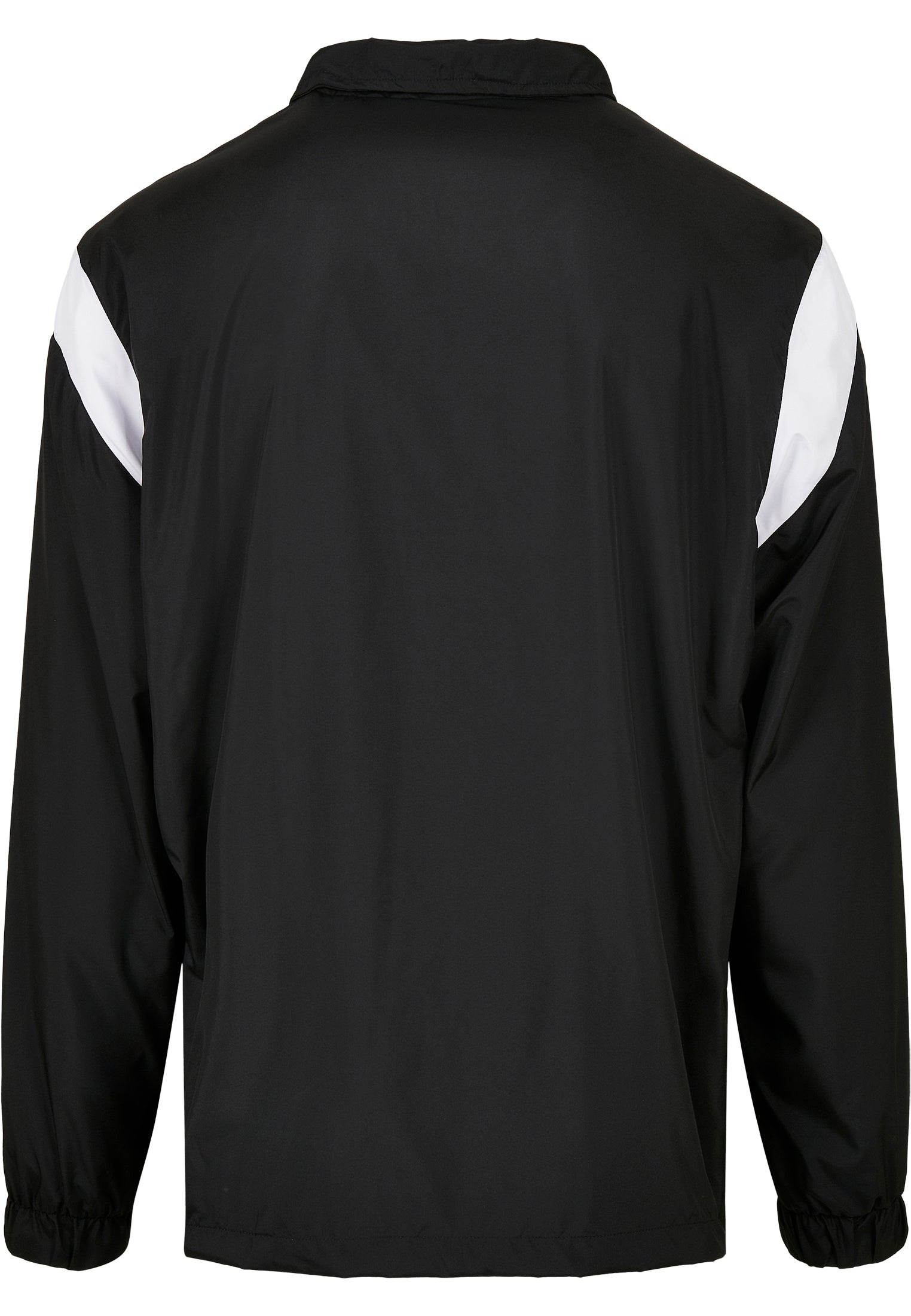 Baksidan av en svart retrojacka med vita färgblock på axlarna.