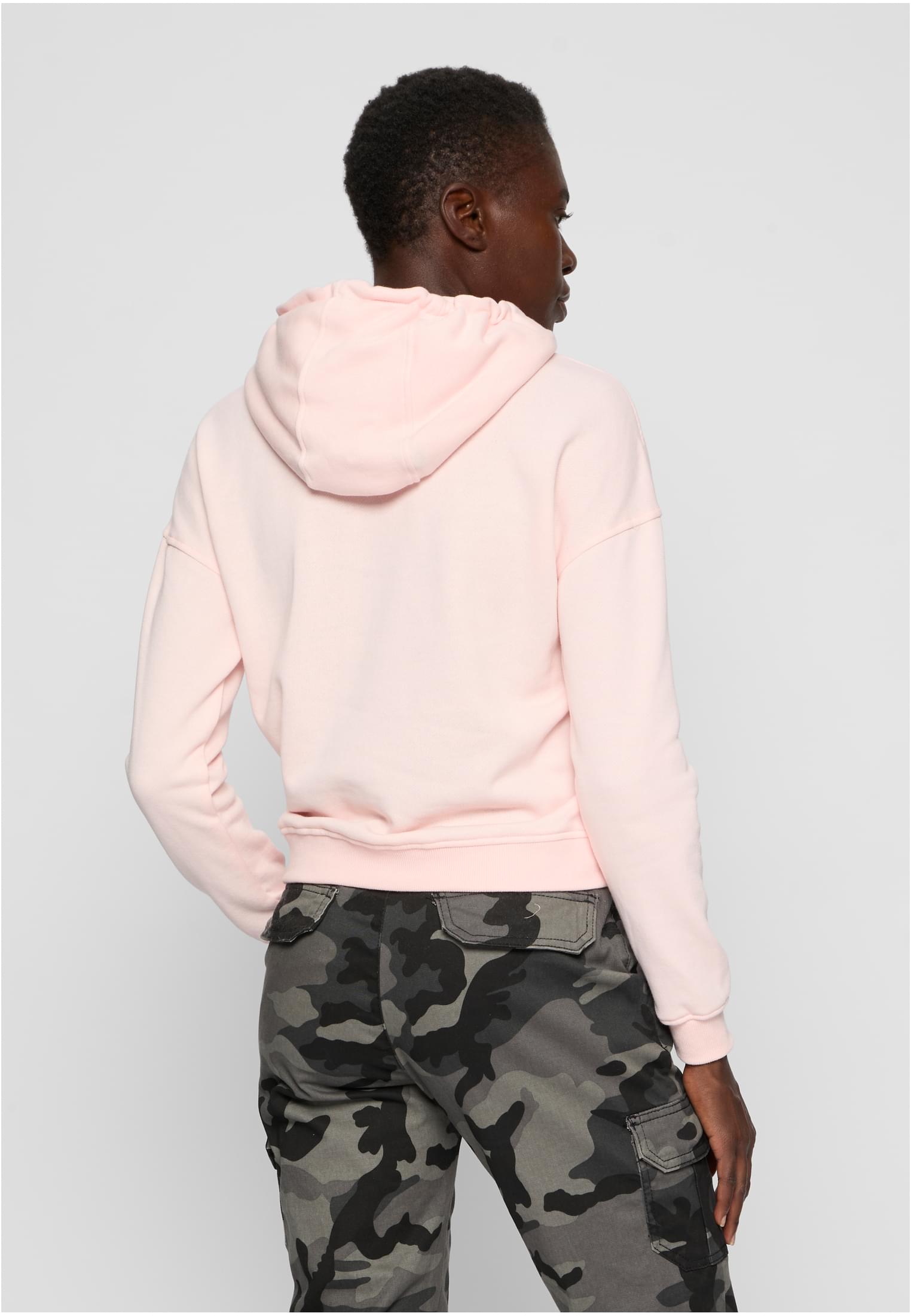 Baksidan av Ladies Hoody i ljusrosa färg på en modell.
