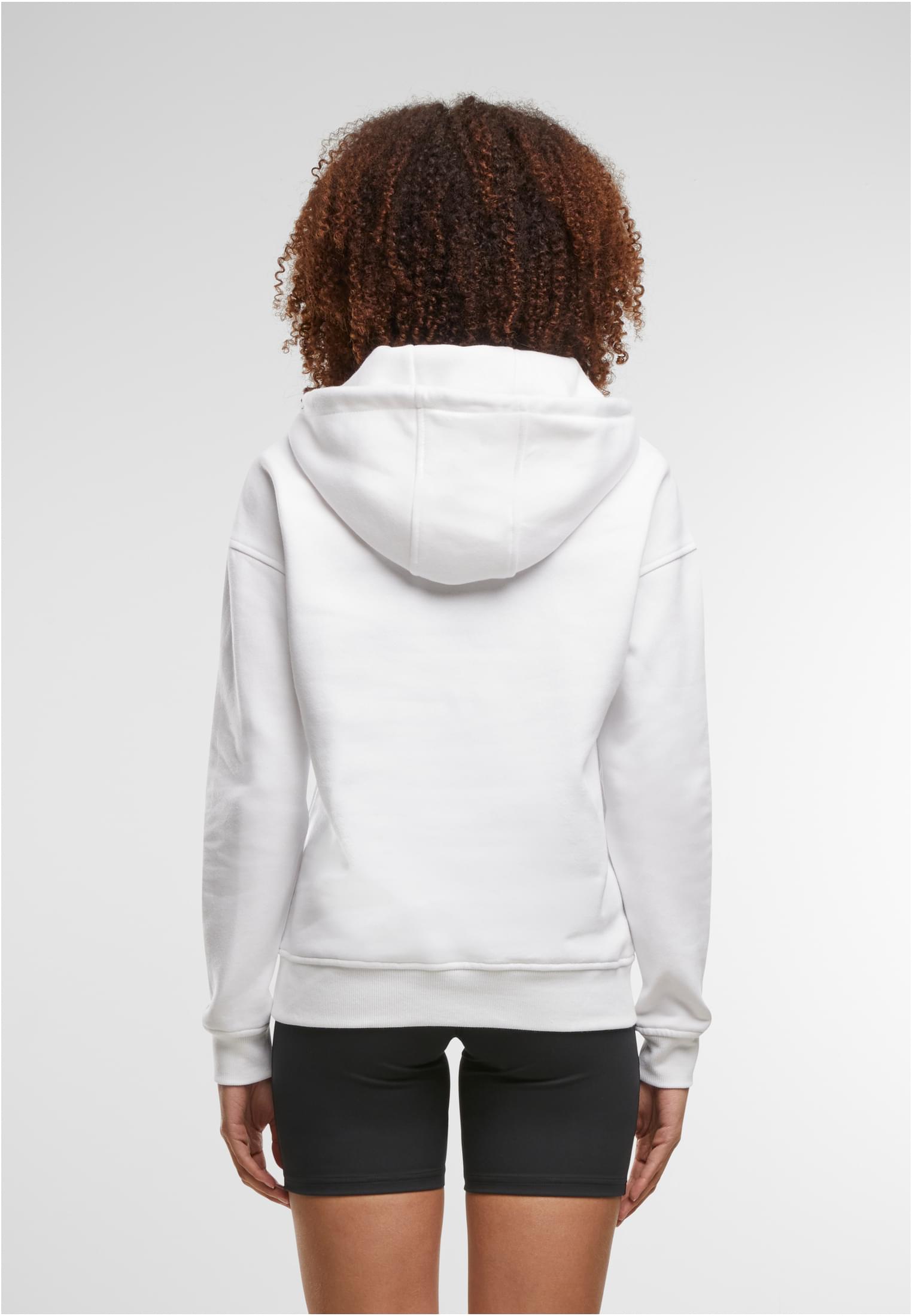 Kvinna sedd bakifrån som bär en vit Ladies Hoody.