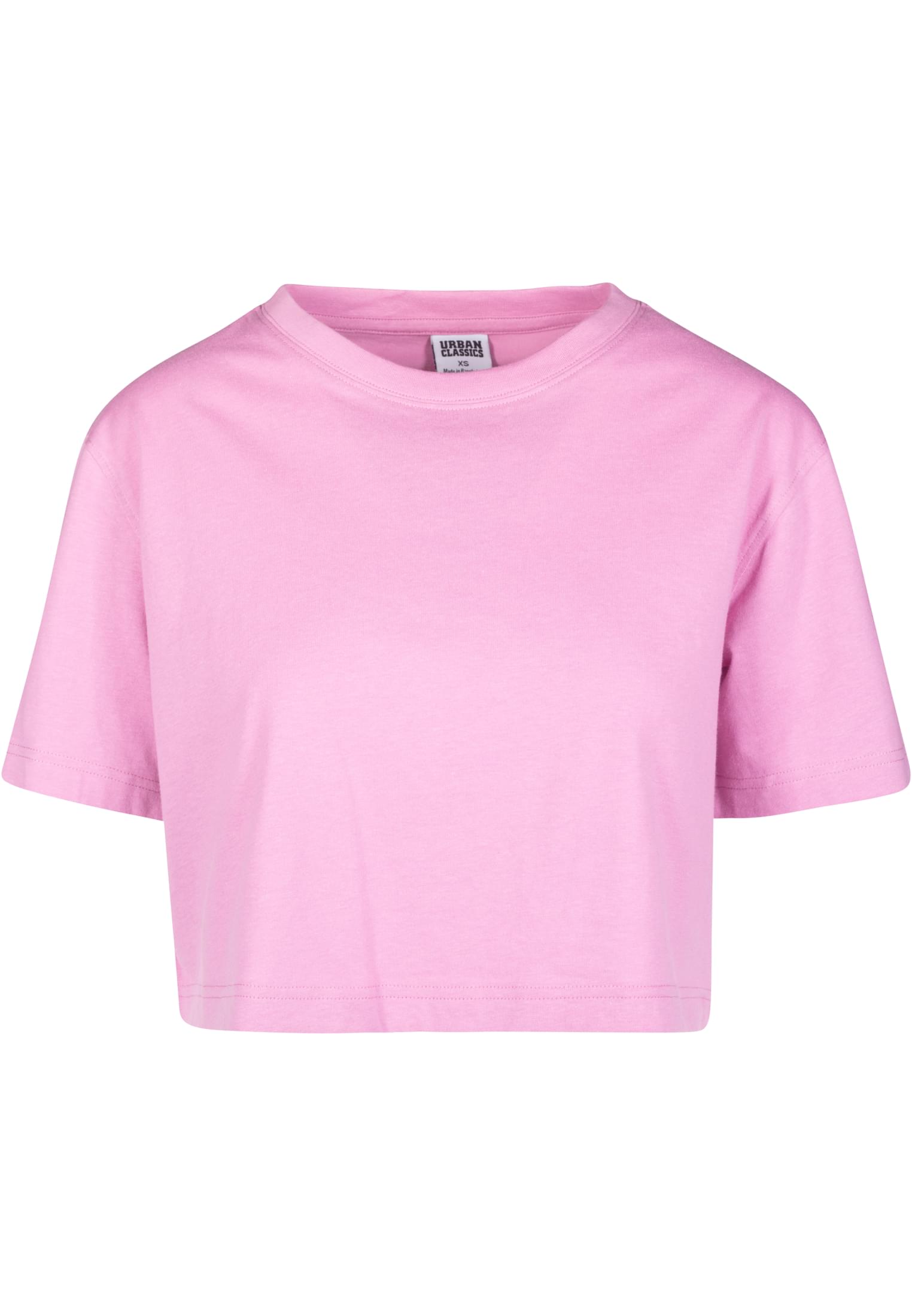 Framsida av en rosa, kort och oversized t-shirt för damer.