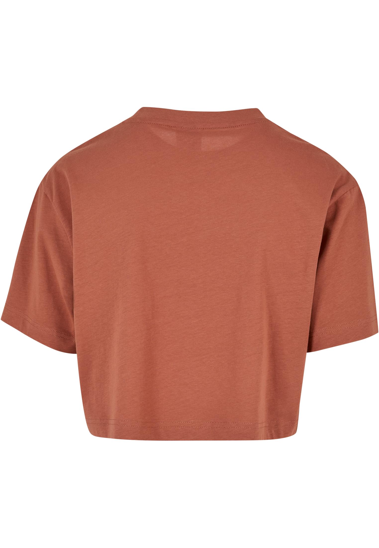 Baksidan av en kort, oversized t-shirt för damer i terrakottafärg.