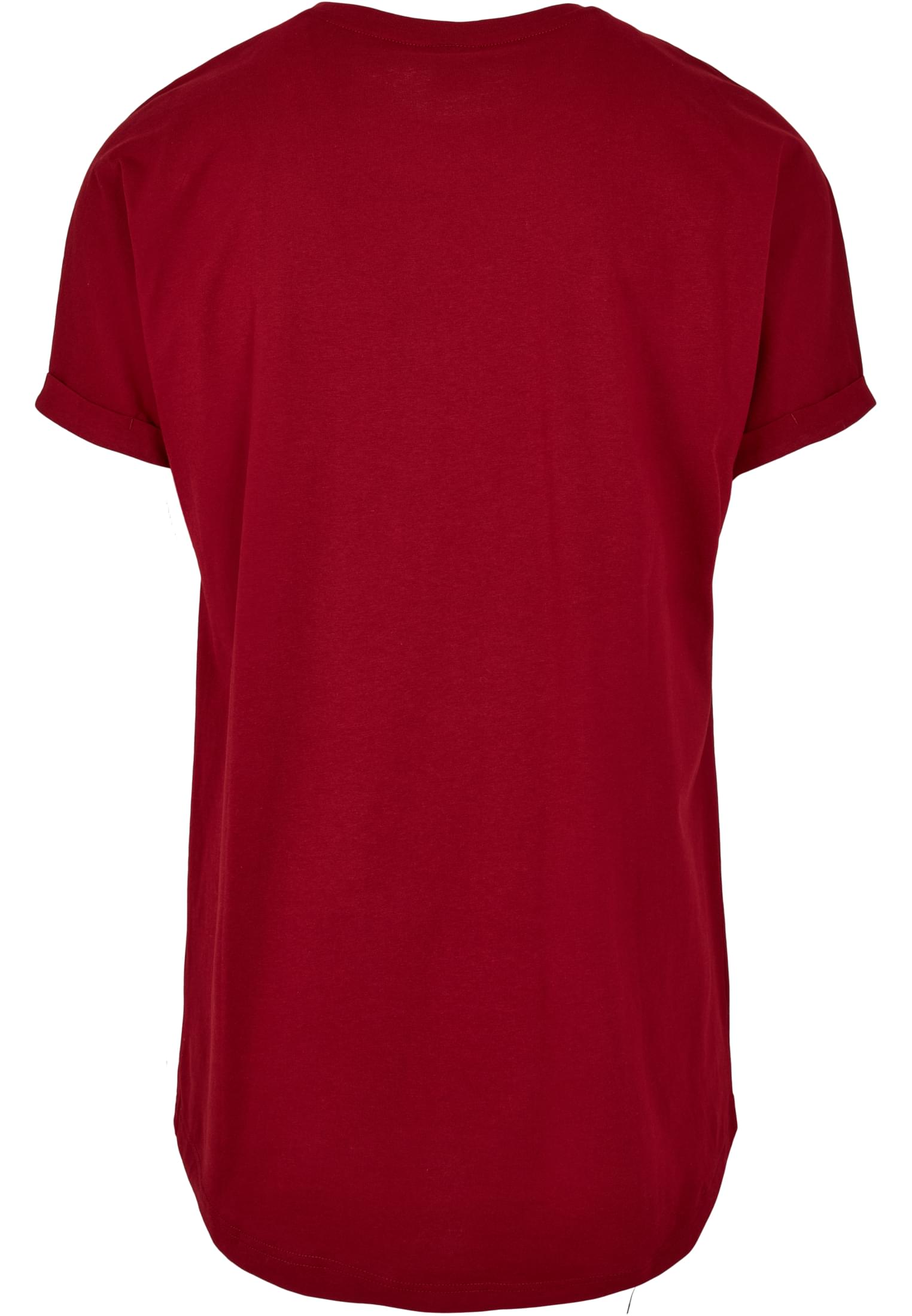 Baksidan av en terrakottafärgad t-shirt med uppvikta ärmar och en längre, rundad nederkant.