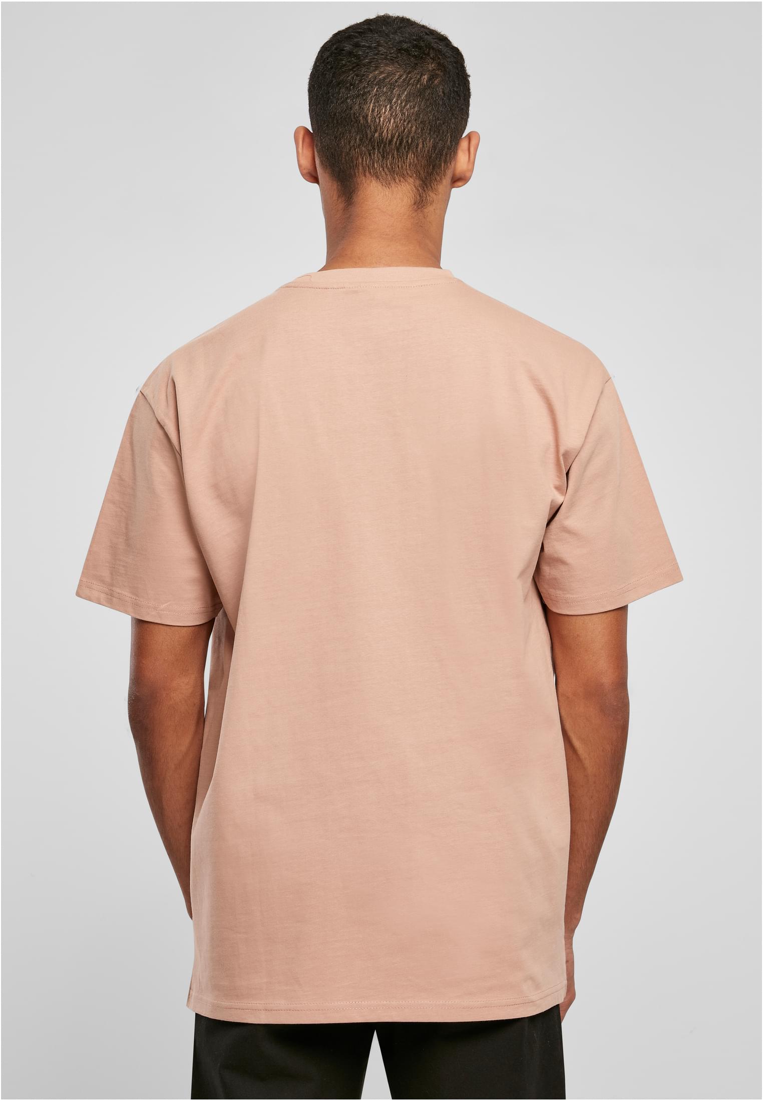 Heavy Oversized Tee i färgen frostmint, sedd bakifrån på en manlig modell.