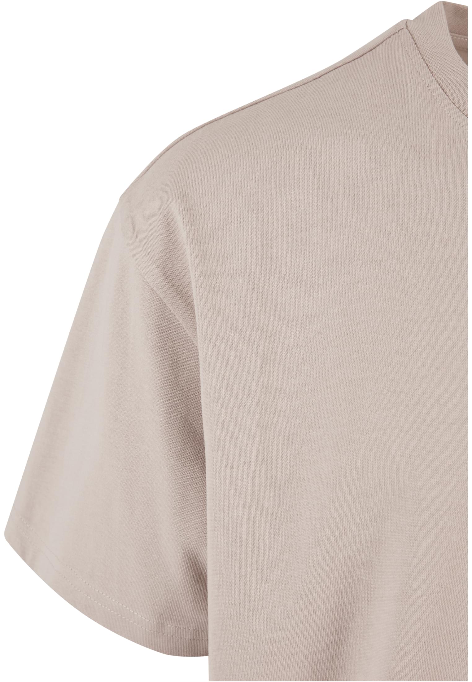 Närbild på axelpartiet och ärmen på en Heavy Oversized T-shirt i frostmint.