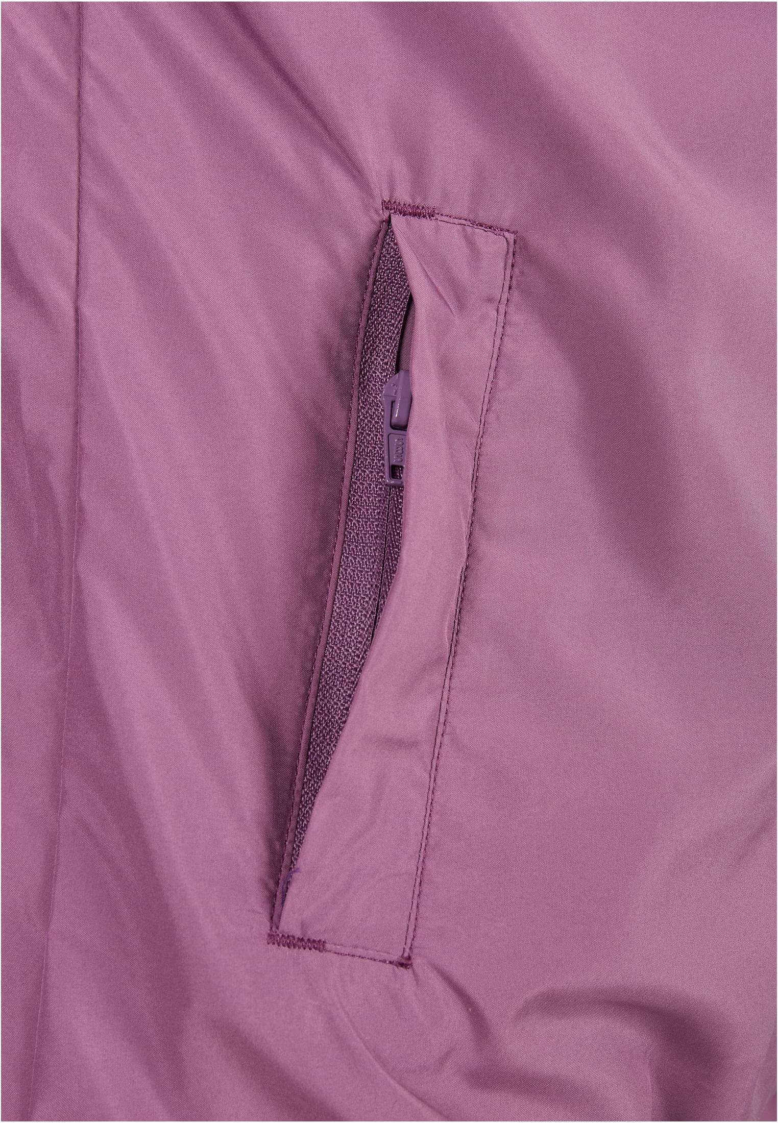 Detaljbild av fickan med dragkedja på Ladies Basic Pull Over Jacket.