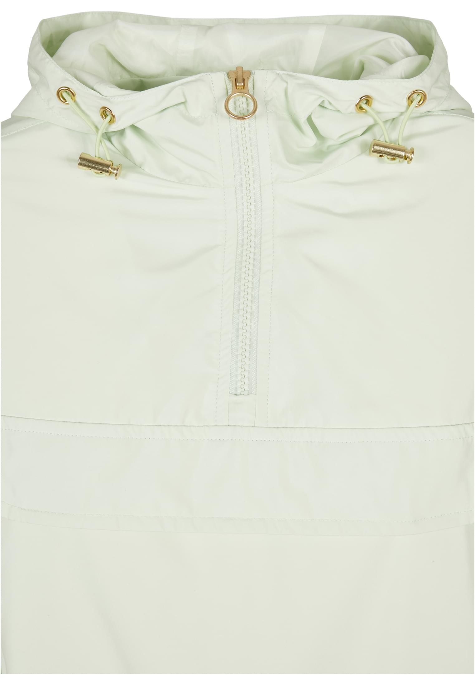 Närbild på den ljusgröna UC Ladies Basic Pull Over-jackan, med fokus på huvan och de guldfärgade detaljerna på dragkedjan.