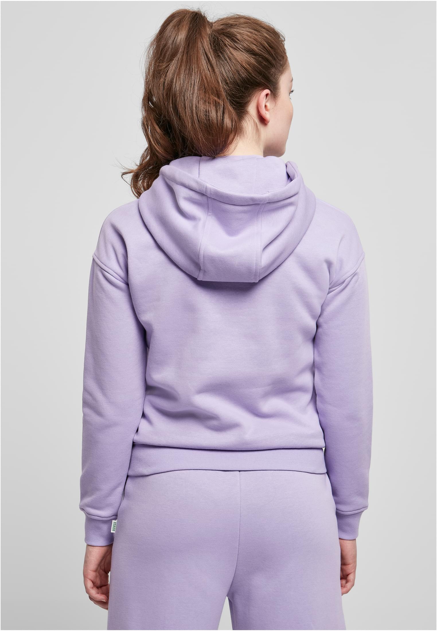 Kvinna sedd bakifrån som bär en ljuslila Ladies Organic Hoody.