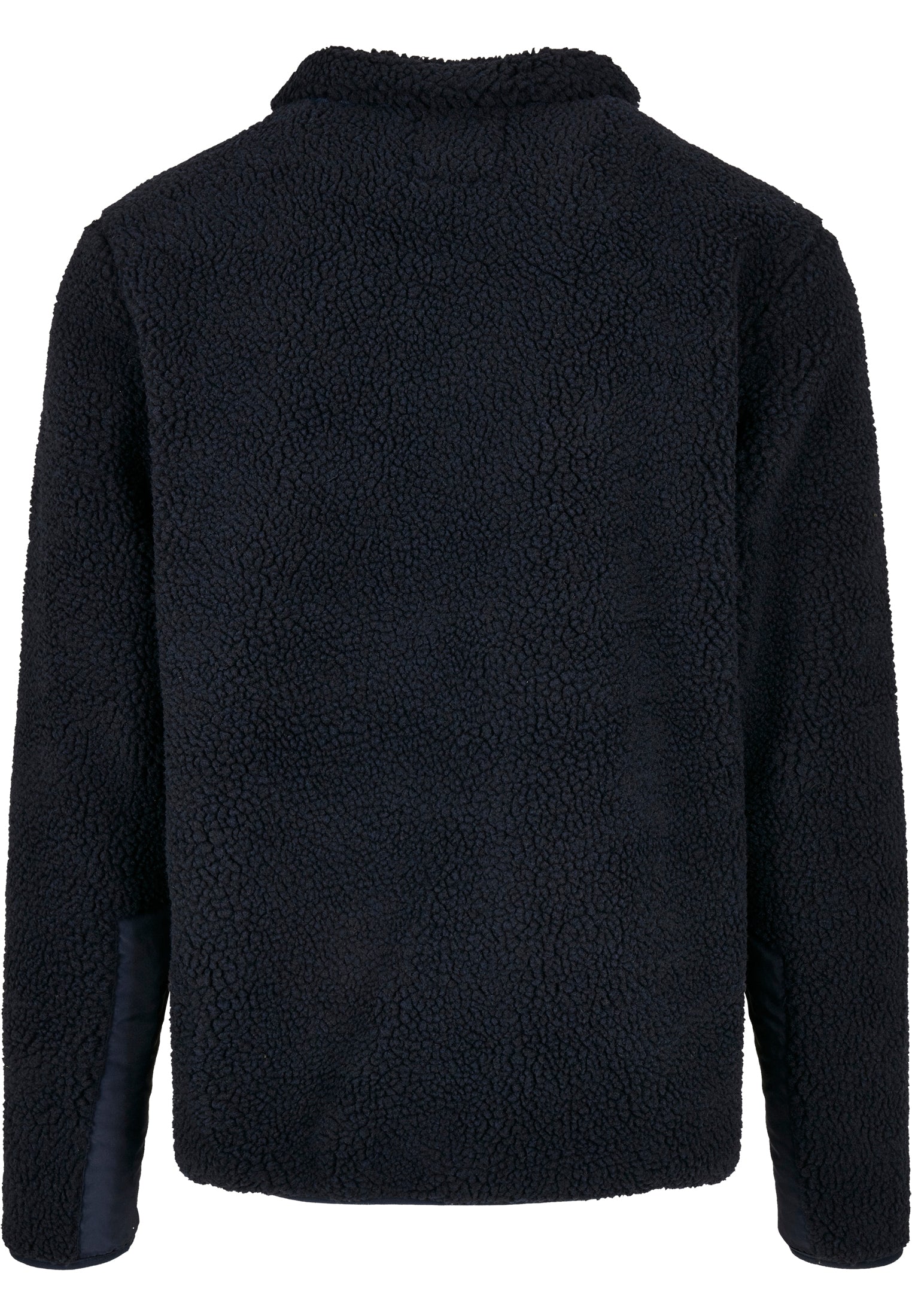 Baksidan av den marinblåa UC Sherpa-jackan, som visar den fluffiga fleecetexturen.