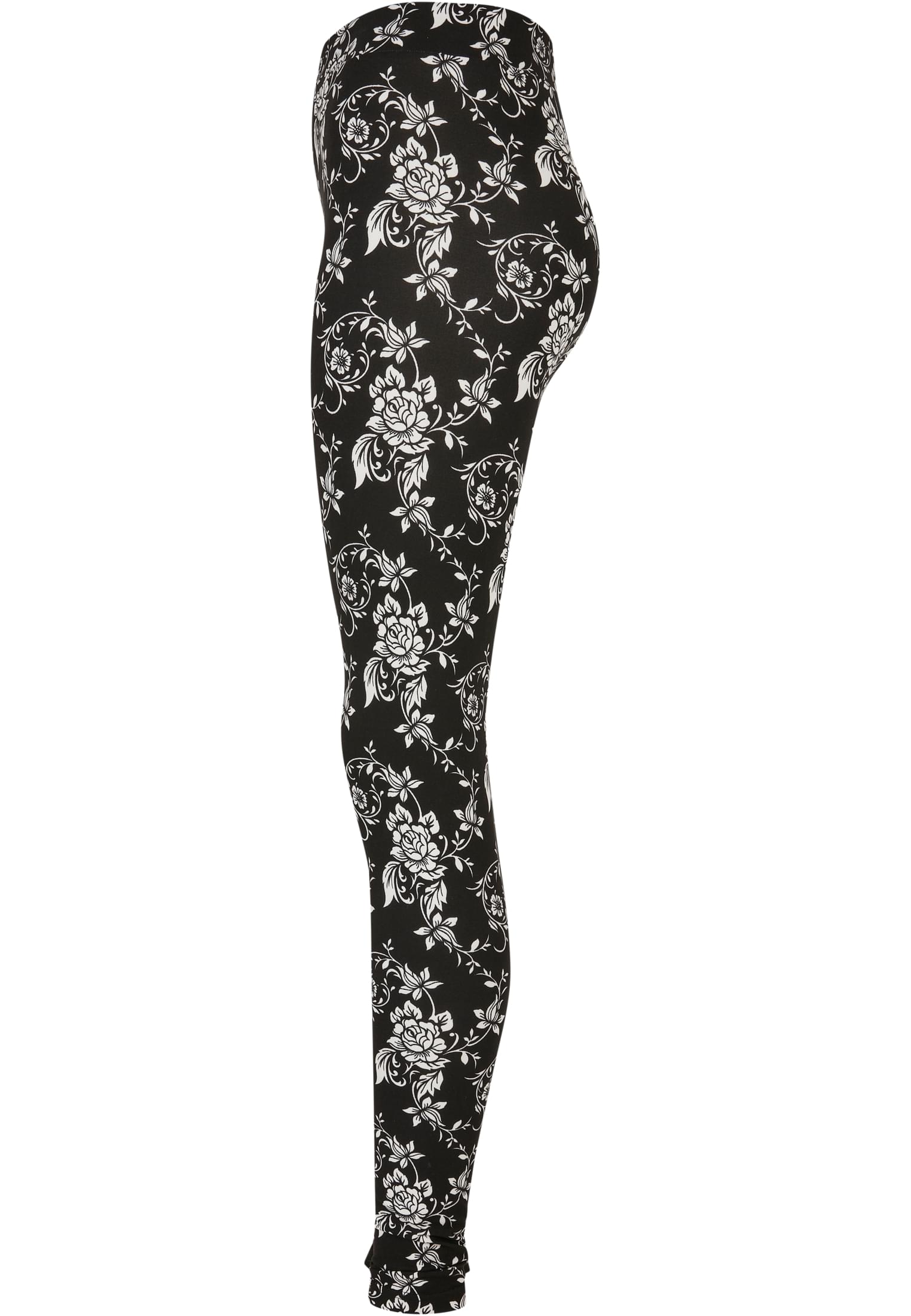 Sidovy av UC Ladies Soft AOP Leggings i svart med ett heltäckande vitt blommönster.