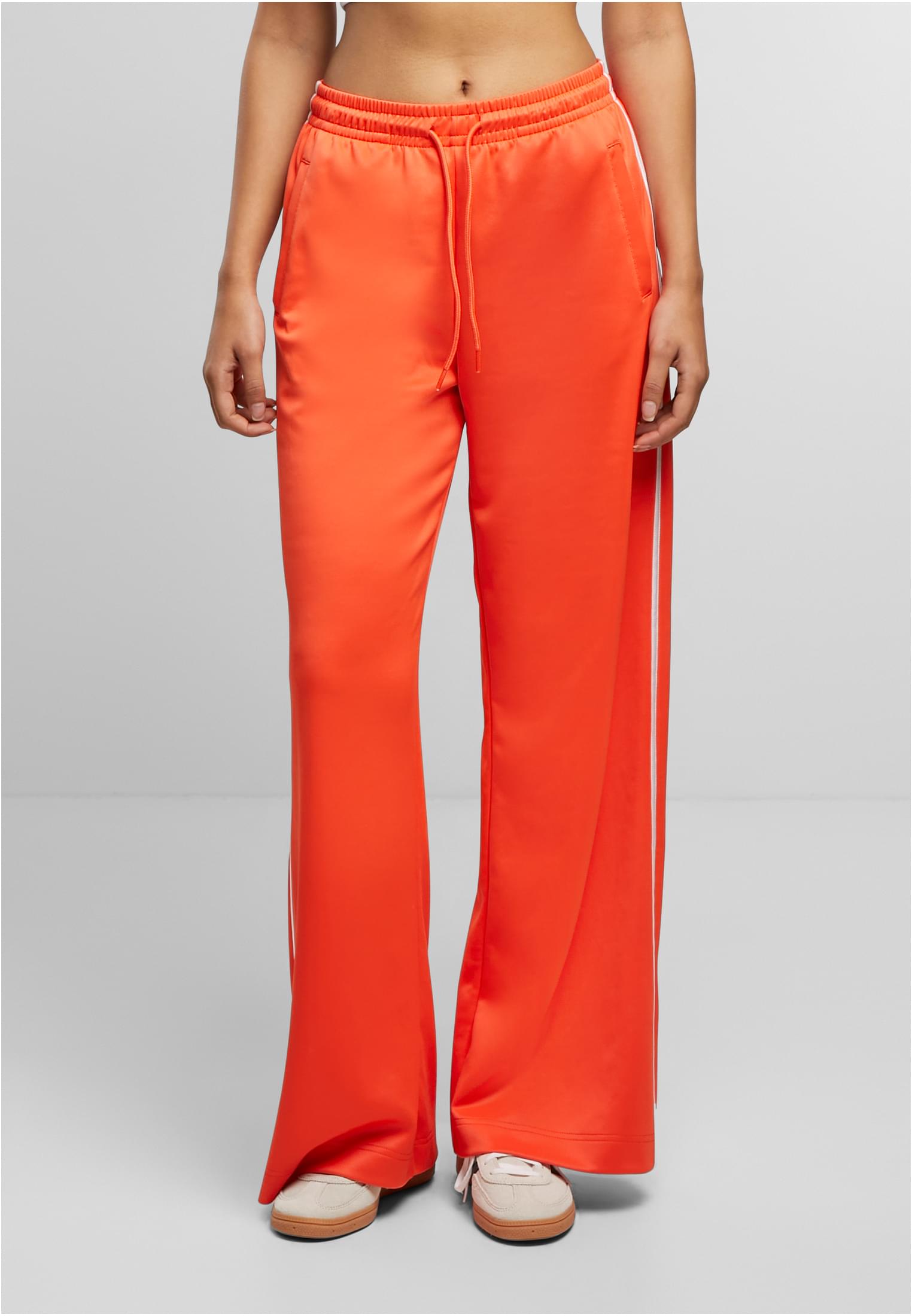 Calças de corrida de perna larga da UC